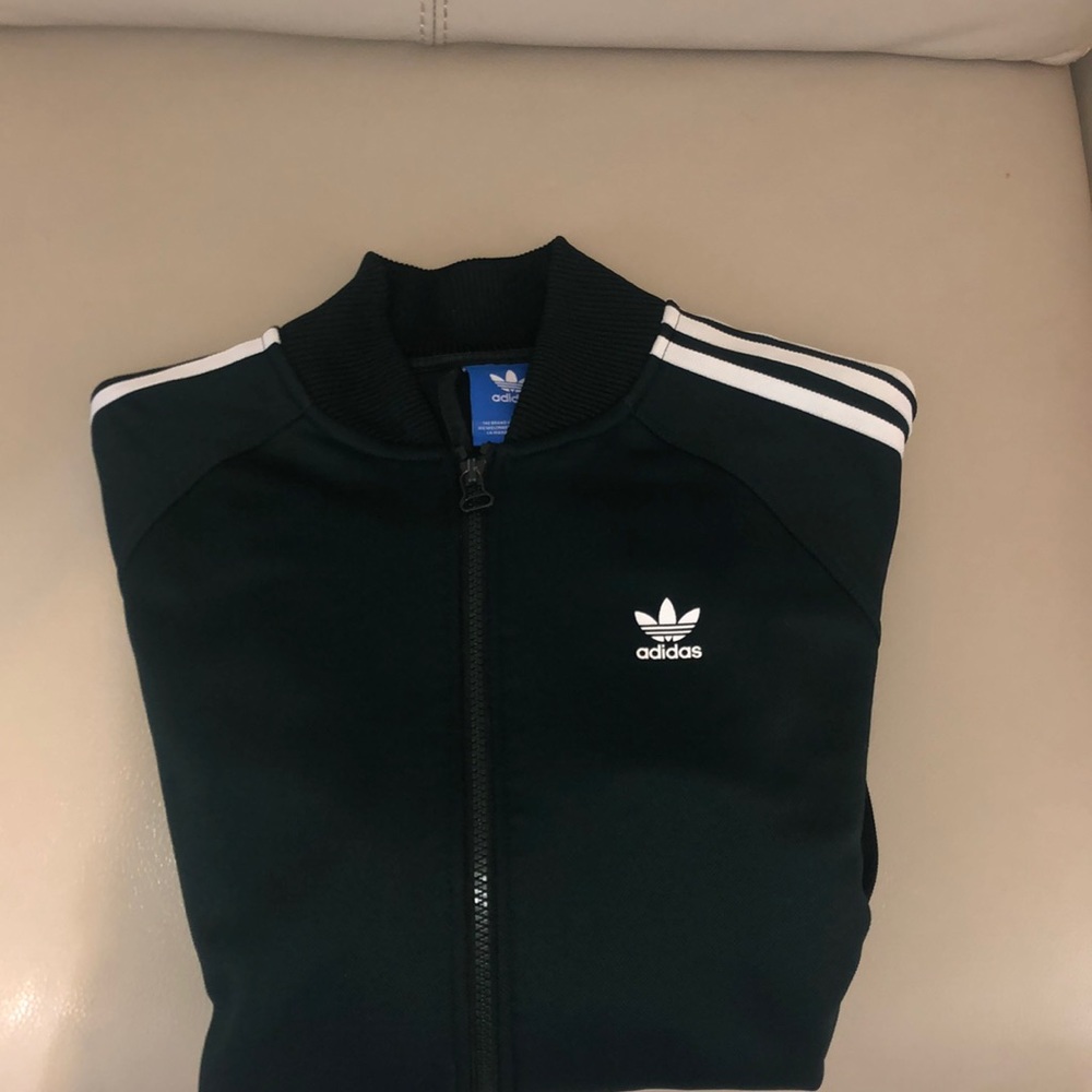 Brand:adidas size: medium color: white and green never been worn